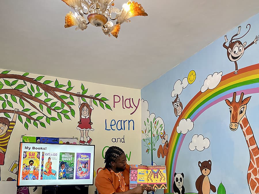 Bernard performing animated storytelling with children joining in