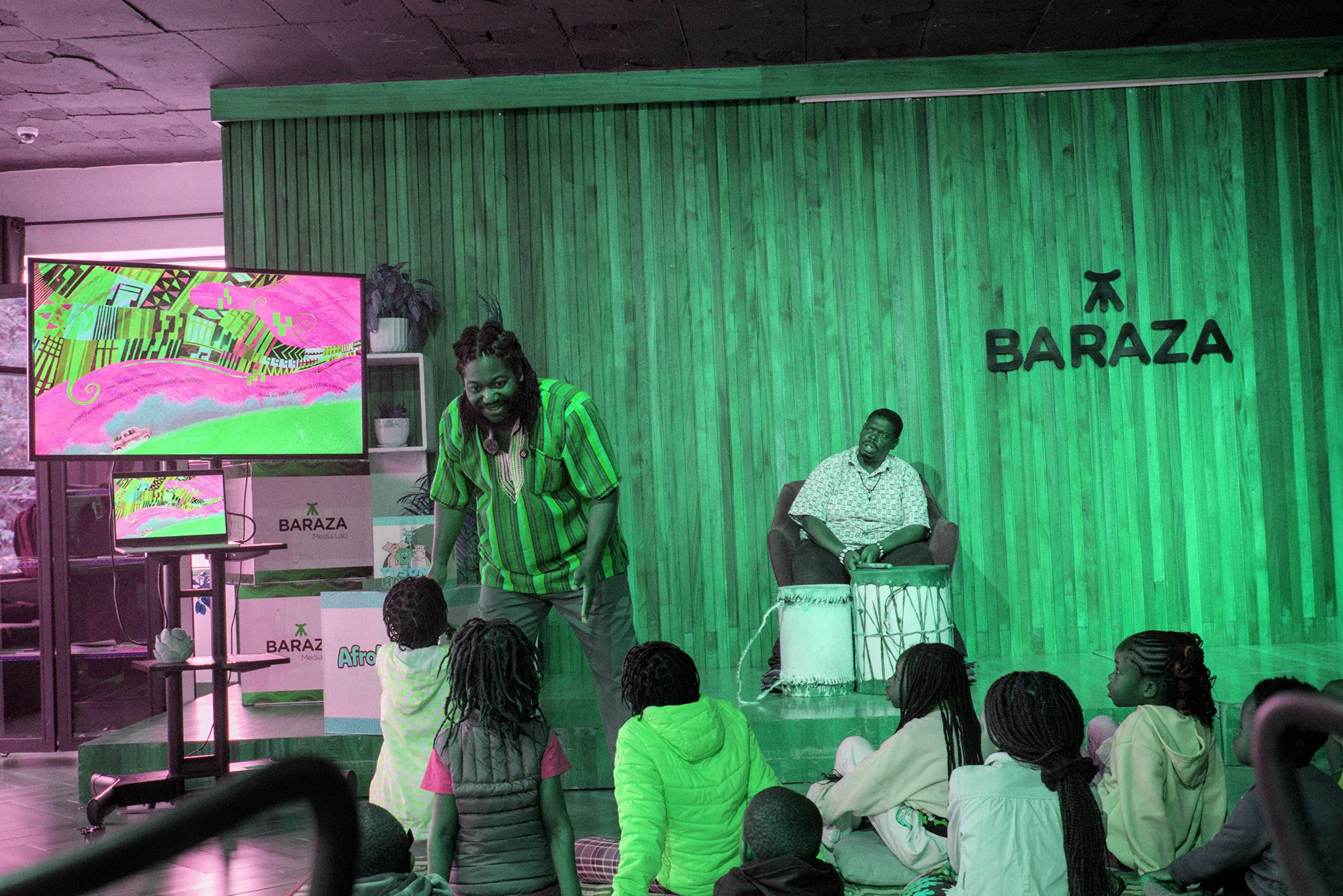 Bernard telling a story to children at the Afrokidz reading event, August 2026