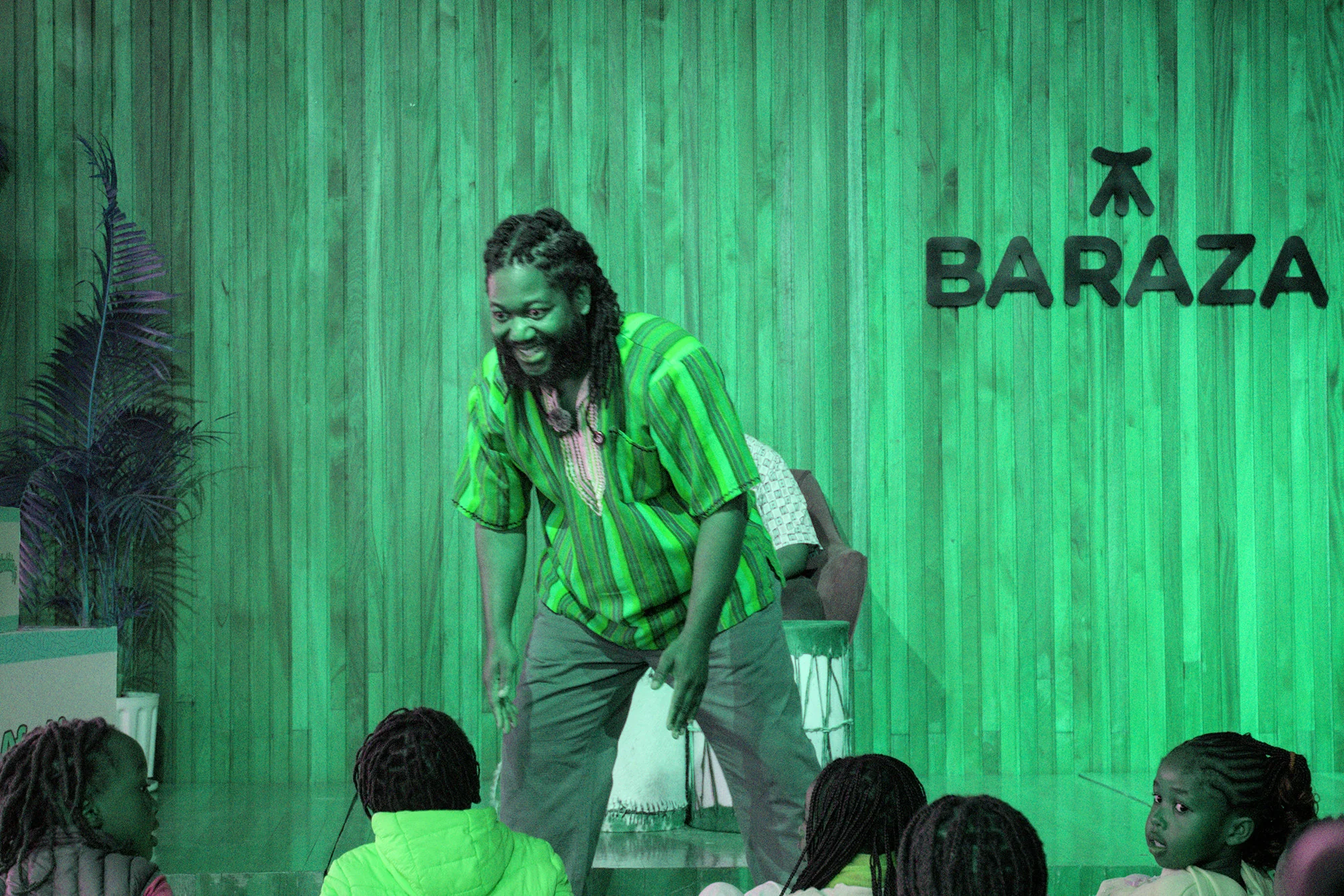Bernard telling a story to children at the Afrokidz reading event, August 2026